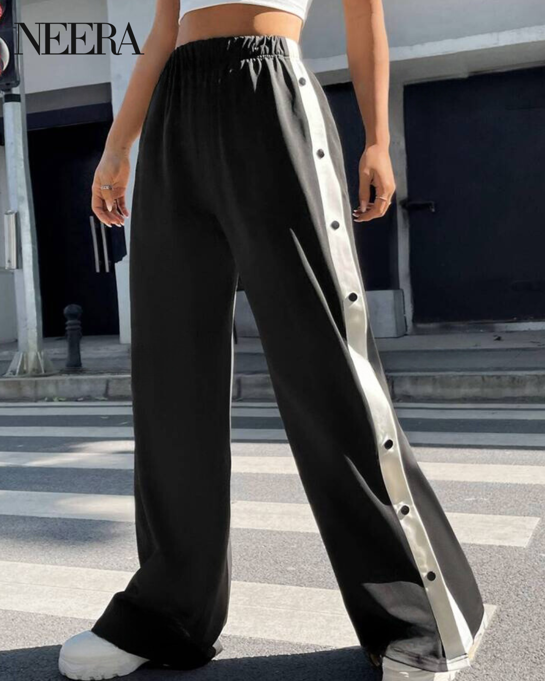 Trousers with side buttons and stripes